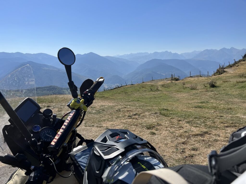 Motorcycle with Pyrenees in background.