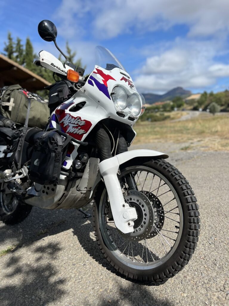 Beautiful Africa Twin next to a single track.
